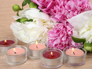 bouquet of peonies and candles