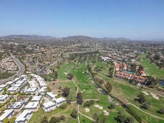 Fototapeta na wymiar Aerial view of houses and condos with golf in Carlsbad, North County San Diego, California, USA.