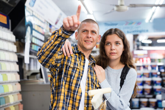 Married Couple Points To Something In A Hardware Store