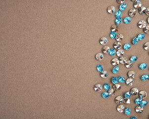 shiny rhinestones on a brown background