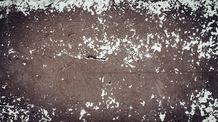 An old destroyed wall with cracks and scratches. Abstract grunge background texture for design posters, advertising and more.