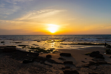 Top view of the sunset on the beach with rocks, Palmachim beach, Israel