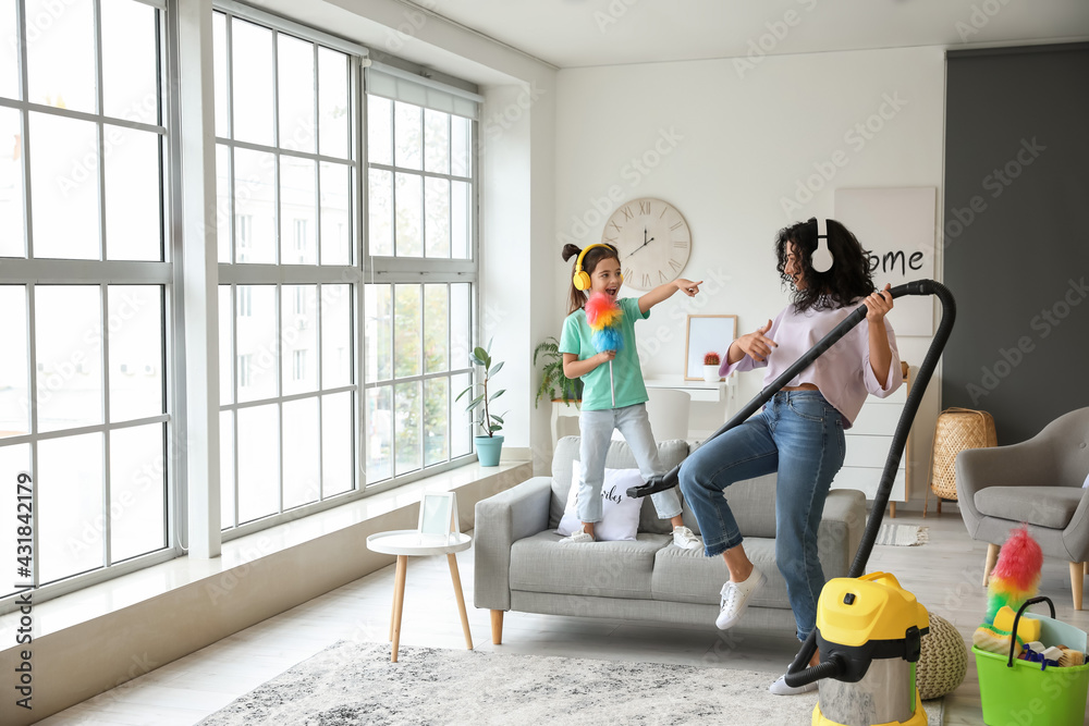 Sticker Mother and daughter having fun while hoovering floor in flat