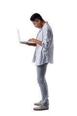 Teenage boy with bad posture using laptop on white background