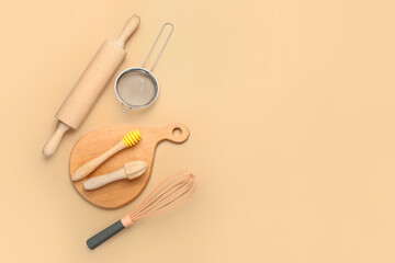 Set of kitchen utensils on color background