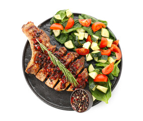 Tasty steak with spices and vegetables on white background