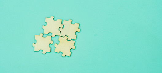 Wooden blank puzzle jigsaw pieces arrangement on paper. Teamwork success and strategy concept, cooperation business solutions think or new idea, Security help support management, copy space.mock up.