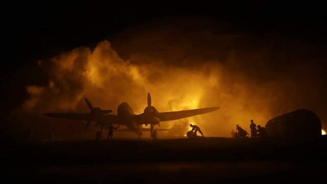 German Junker (Ju-88) night bomber at night. Artwork decoration with scale model of jet-propelled plane in possession. Toned foggy background with light. War scene. Selective focus