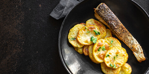 baked fish and potato fried slice garnish seafood omega diet meal snack copy space food background rustic top view