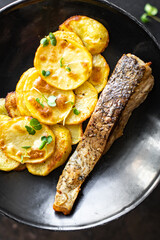 baked fish and potato fried slice garnish seafood omega diet meal snack copy space food background rustic top view