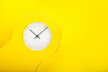 Stylish clock on color background