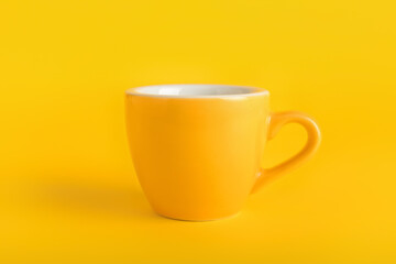 Stylish cup on color background