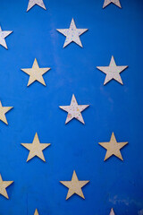 Grunge concrete wall background star shaped blue background