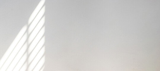 Architectural shadows. Sunlight architecture abstract background with light, black shadow overlay from window on white texture wall. Mockups, posters, stationary, wall art, design presentation.