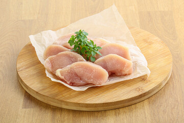 Raw chicken breast slices for cooking