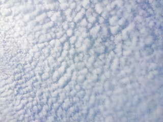 Obraz premium white dappled cloud pattern in blue sky for natural background.