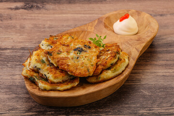 Zucchini pancakes with herbs and spices