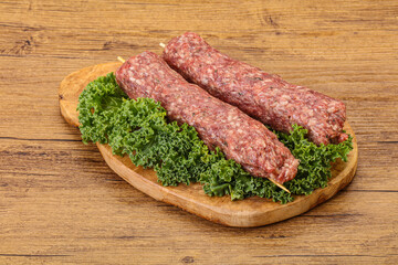 Raw minced beef kebab skewer
