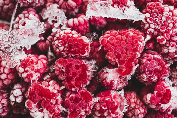 frozen raspberries close-up with visible ice, healthy plant-based food