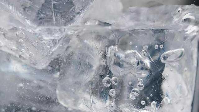 Ice in a glass of water. Macro. High quality 4k footage