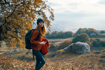 Naklejka premium woman hiker backpack in travel mountains autumn lifestyle