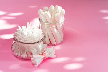 Hygienic tampons and cotton ear buds on paper background