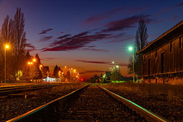 Fototapeta na wymiar sunset, rail, Railway, old buildings