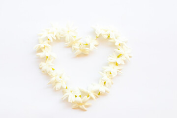 white flowers jasmine local flora of asia arrangement flat lay postcard heart style on background white 