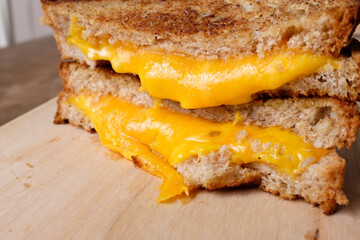 Close up shot of homemade grilled cheese sandwich that shows melting cheese