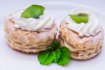 tasty mini puff pastry cakes with fruits