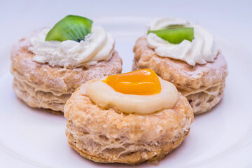 tasty mini puff pastry cakes with fruits