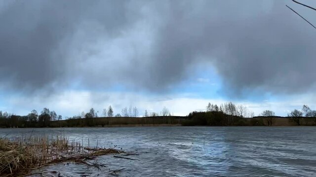 timelapse of the river with rain clouds