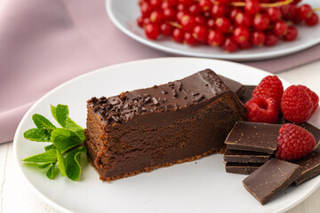 Piece of chocolate cake on table close up