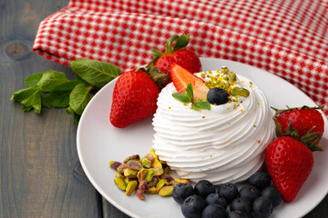 White meringue cake on plate served on table