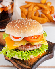 Meat burger. Beef burger on a wooden board. Closeup