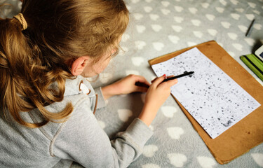 Girl drawing picture. Close up.