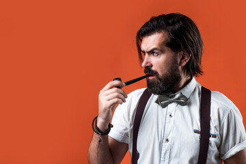 handsome guy hipster with moustache and beardsmoking pipe, smoking