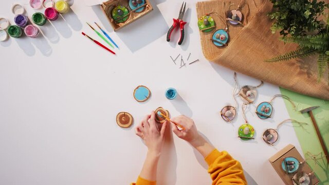 Top view of craftswoman making diy decorations, small business and desktop concept.