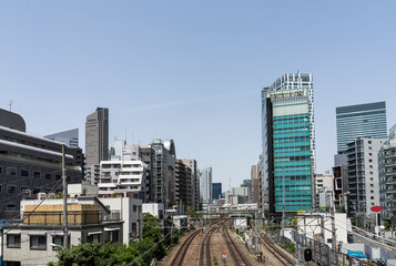 Fototapeta na wymiar 鉄道橋から望む渋谷駅のビル群