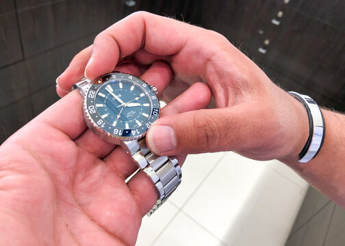 Alicante, Spain- April, 2021: Swiss made professional diver Oris Aquis watch Whale shark limited edition in man hands