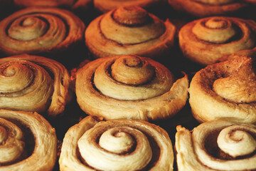 Cinnamon rolls are baked in oven, homemade cakes.