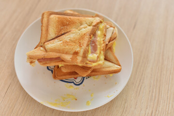 Toasted Bread , On a white plate on a wooden table.