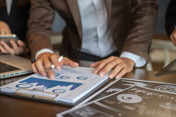 Business Corporate team brainstorming, Planning Strategy having a discussion Analysis investment researching with chart at office desk documents in office.