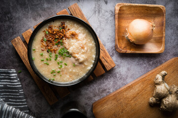 Arroz Caldo flat lay with onion and ginger 