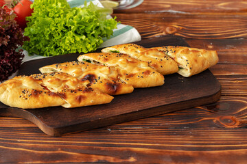 Close up of Turkish Pide bread on wooden table