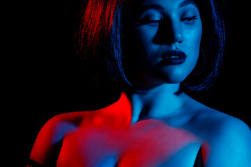 Portrait of a sexy woman in neon lighting.