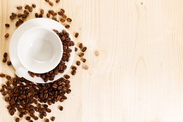 Cup of black coffee with coffee beans.