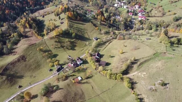 Aerial drone footage showing  the mountain area in Transylvania , Carpathian mountains , named Rucar Bran corridor , connecting historical regions in Romania , autumn season