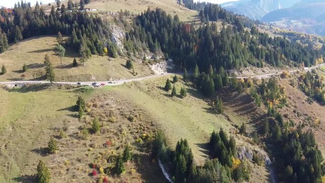 Aerial drone footage showing  the mountain area in Transylvania , Carpathian mountains , named Rucar Bran corridor , connecting historical regions in Romania , autumn season