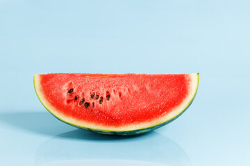 Sliced watermelon on blue background